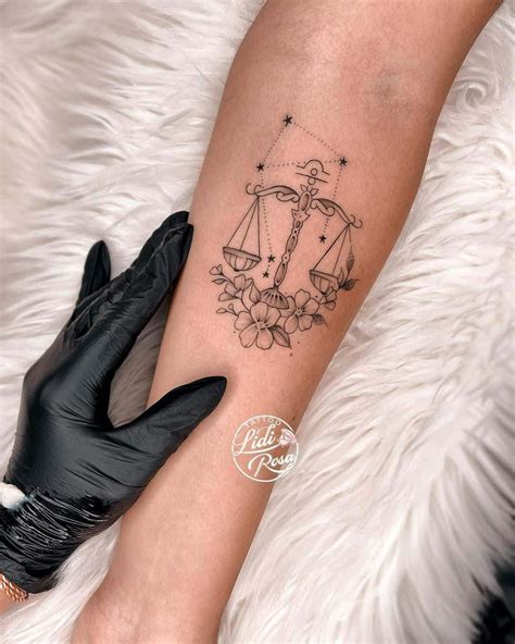 libra star sign tattoo.